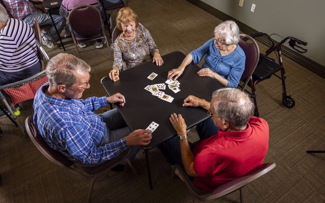 A friendly card game brings residents together at Willow Brook Village in Delaware, Ohio, where shared games and conversation are part of the everyday senior living calendar.